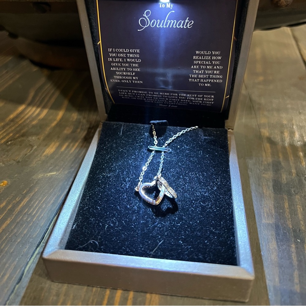 Interlocking hearts, rose gold, and silver titanium